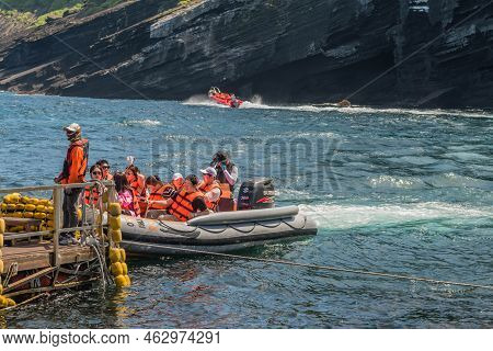 Udo Island, South Korea; June 22, 2022: Unidentified Tourist Wearing Life Vest In Rubber Dingy At Do