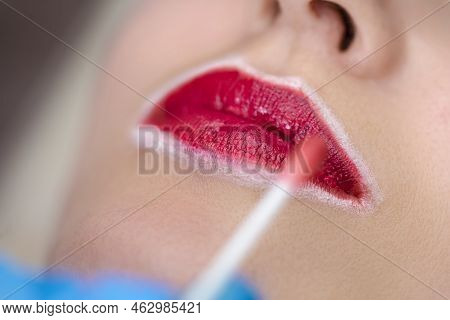 Closeup Of Young Caucasian Woman Face And Lips During A Process Of Permanent Lips Makeup In Tattoo S