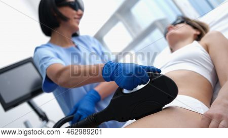 Adult Woman With Laser Hair Removal In Professional Beauty Salon. Hair Removal In Hone Bikini Concep
