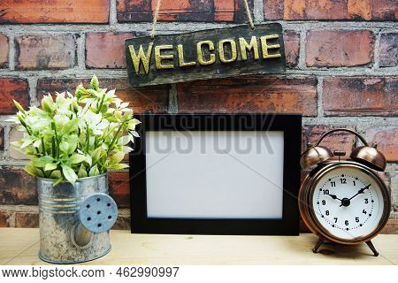 Empty Photo Frame Mock Up With Welcome Sign And Artficial Plant Home Decoration
