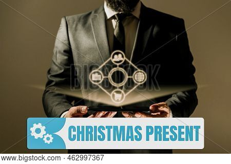 Hand Writing Sign Christmas Present. Business Overview Presented As A Gift Given In Celebration Of C