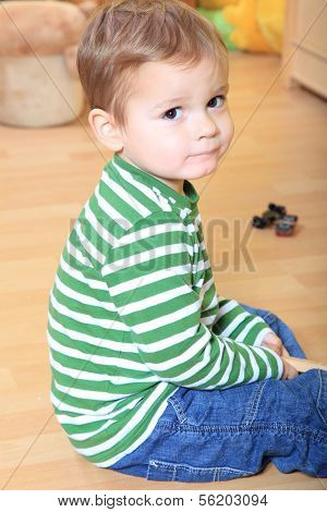 Cute caucasian toddler in kindergarten.