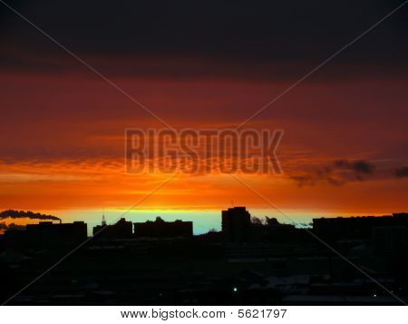 Red dawn. City. The sky.