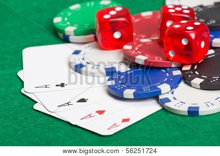 Playing Poker Chips, Dice And Cards On The Green Table