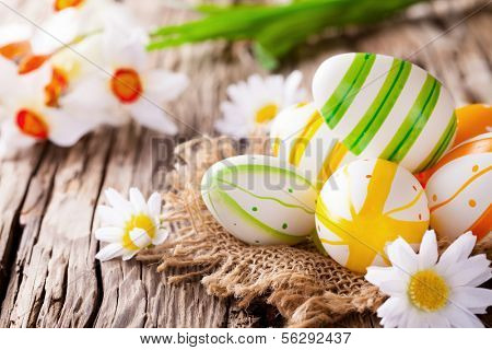 Easter still life with traditional decorative colored eggs in nest
