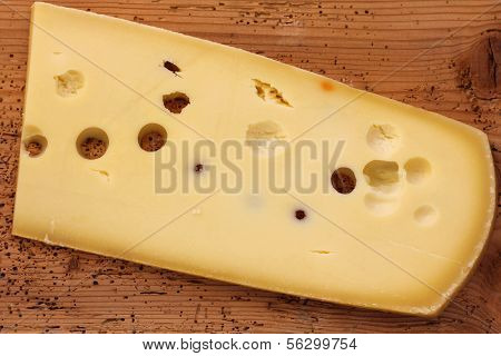 Big Emmental Cheese (Emmentaler) from Switzerland on a wooden board