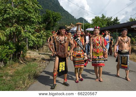 SARAWAK, MALAYSIA: JUNE 1, 2014: People of the Bidayuh tribe, an indigenous native people of Borneo, in traditional costumes, take part in a street parade to celebrate the Gawai Dayak festival.
