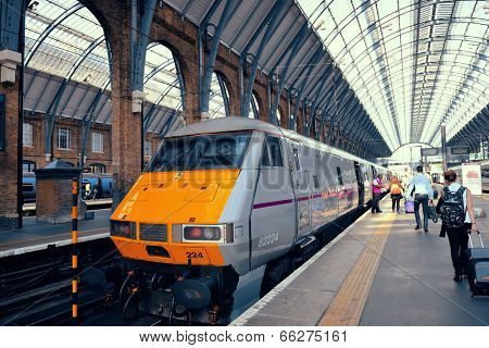 LONDON, UK - SEP 27: Kings Cross station with train on September 27, 2013 in London, UK. Opened in 1852, it is the southern terminus of the East Coast Main Line.