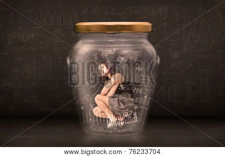 Businesswoman traped in jar with graph chart symbols concept on background
