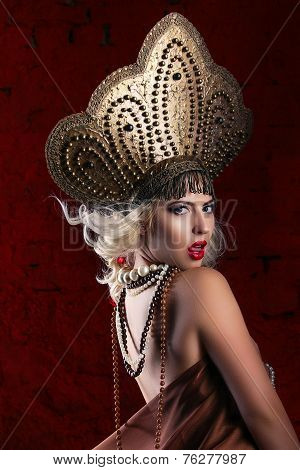 Russian Beauty. Attractive female wearing in kokoshnik. Woman's headdress in old Russia