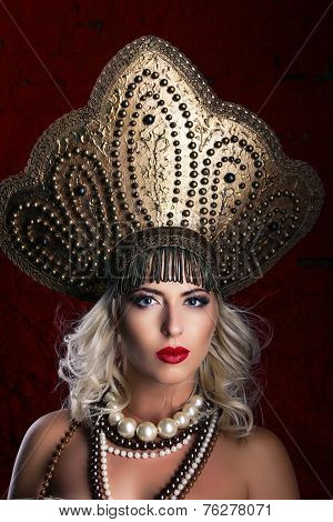Russian Beauty. Attractive female wearing in kokoshnik. Woman's headdress in old Russia