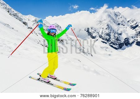 	Skiing, winter, ski lesson - young skier on mountainside