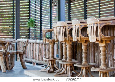 Old wooden chair in front of bar