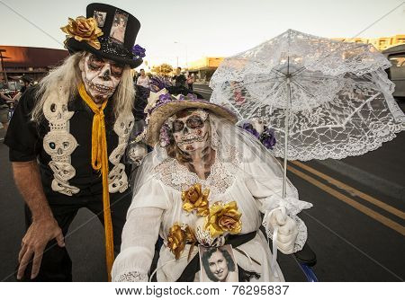 Senior Couple In Dia De Los Muertos Face Paint