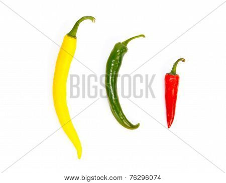 Three Peppers In A Row In Different Colors