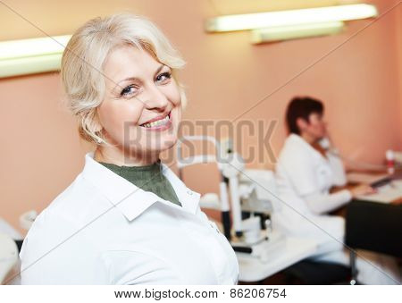 Ophthalmology. portrait of female optometrist optician doctor in eye correction medic clinic 