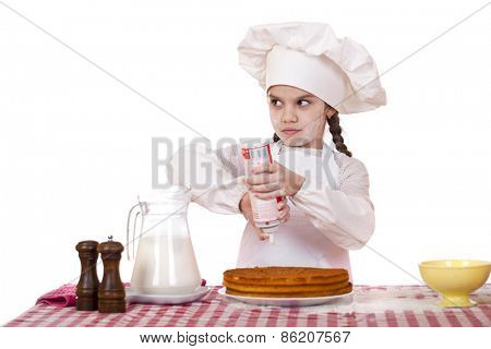 Cooking and people concept - smiling little girl in cook hat, isolated on white background