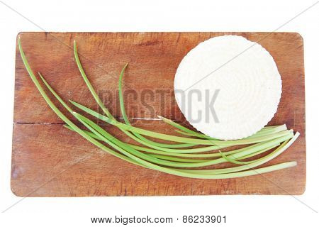 dairy products : feta white cheese on cut board isolated over white background