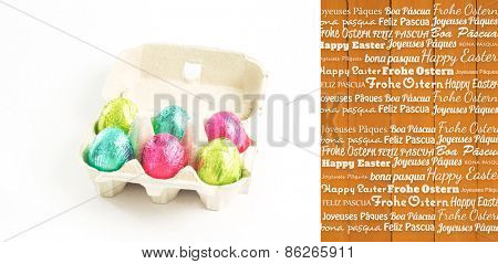Happy easter in different languages against wooden planks
