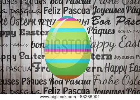easter egg against wooden planks