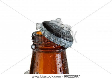 Close Up View Of An Ice Cold Beer Bottle Neck And Removed Cap