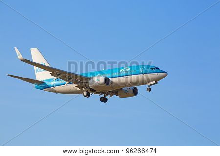 ZURICH - JULY 18: KLM Boeing-737 landing in Zurich airport after short haul flight on July 18, 2015 in Zurich, Switzerland. Zurich airport is home for Swiss Air and one of the biggest European hubs.
