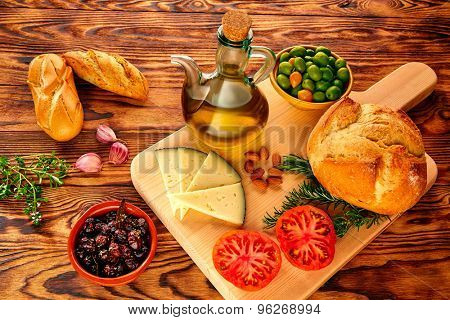 Mediterranean food bread oil olives cheese peppers garlic almods rosemary