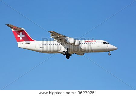 ZURICH - JULY 18: AVRO RJ100 landing in Zurich airport after short haul flight on July 18, 2015 in Zurich, Switzerland. Zurich airport is home port for Swiss Air and one of the biggest european hubs.