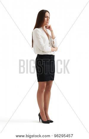 despondent businesswoman thinking about something and looking down. isolated on white background