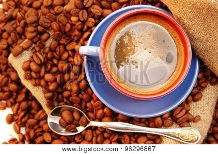 Coffee Beans Cup With Coffee And Spoon
