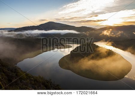 Misty sunrise at Alagon River Meander. This place is called The Melero and is not far from Riomalo de Abajo Hurdes Spain