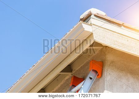 House with New Seamless Aluminum Rain Gutters.