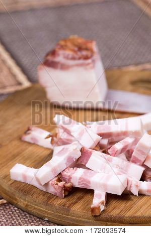Sliced Chopped Bacon On The Kitchen Wooden Board