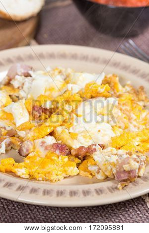 Fried eggs with bacon served on the table.