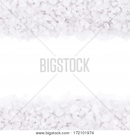 Copyspace backdrop composition with the borders made of salt crystals isolated over the white background