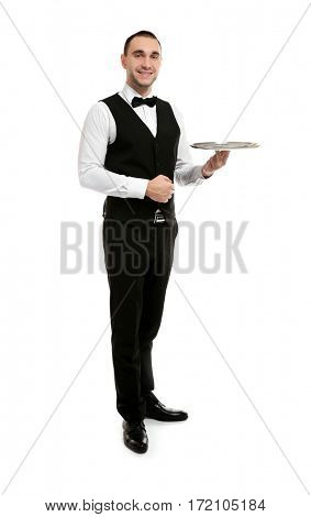 Young handsome waiter holding tray on white background