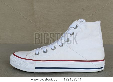 close up vintage style of sport white sneaker shoe on white background