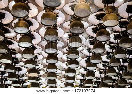 Old storm lanterns hang under the ceiling