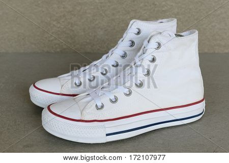 close up vintage style of sport white sneaker shoe on white background