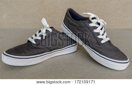 close up vintage style of sport gray sneaker shoe on white gray background
