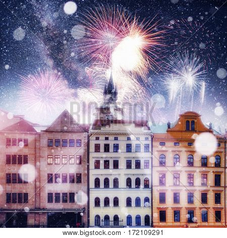 beautiful houses Czech Republic. Photo greeting card. Bokeh light effect, soft filter. Colorful fireworks on the black sky background