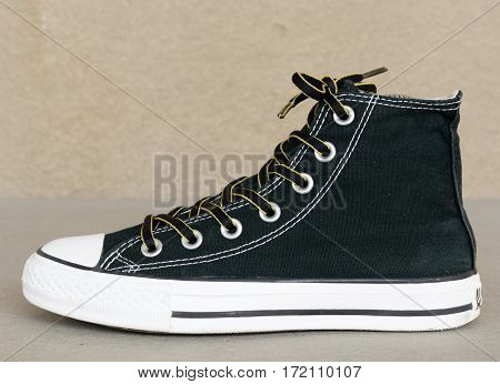 close up vintage style of sport black sneaker shoe on white background