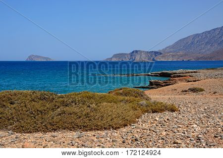 View of the sea and rugged coastline near Ammoudara Crete Greece Europe.