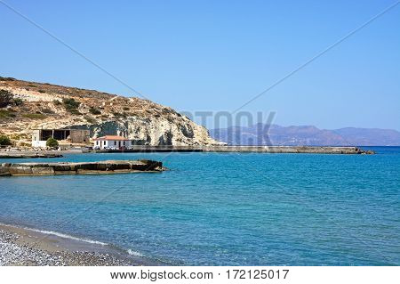 View of the beach and small harbour near Ammoudara Crete Greece Europe.