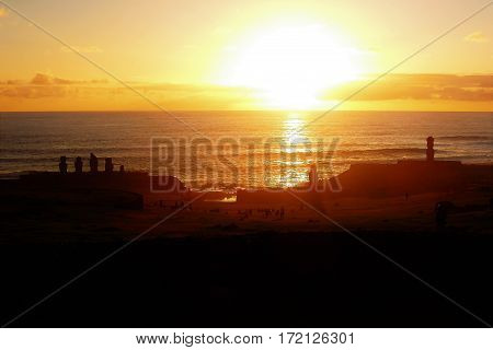 Long shot of the Moai during sunset at Ahu Tahai in Hanga Roa in Rapa Nui Easter Island Chile South America