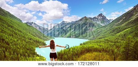 Freedom concept. Beauty girl in mountains on background view Kucherla lake on Altay