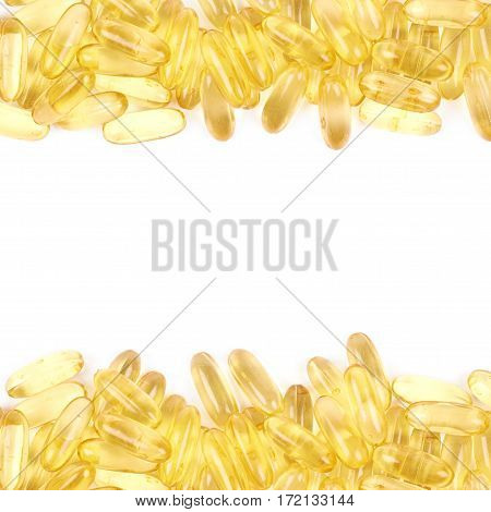 Copyspace medical background composition with the borders made of yellow softgel pills isolated over the white backdrop
