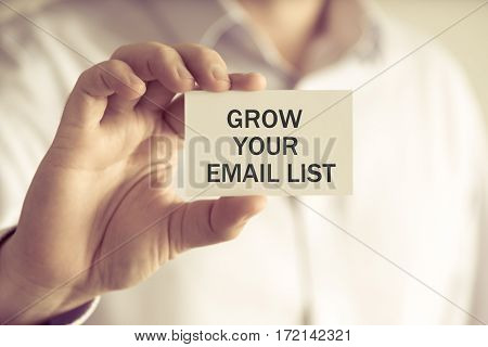 Businessman Holding Grow Your Email List Message Card