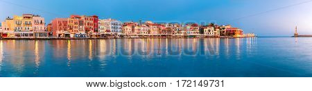 Picturesque panoramic view of old harbour with Lighthouse of Chania at sunrise, Crete, Greece