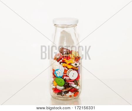 a bottle of specialized apparel fasteners - buttons